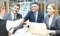 Welcome to our team. Young modern businessmen shaking hands while working in the creative office Royalty Free Stock Photo