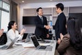 Welcome to our team of young modern men in smart casual wear shaking hands while working in the creative office Royalty Free Stock Photo