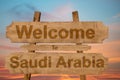 Welcome to Saudi Arabia sign on wood background Royalty Free Stock Photo