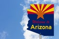 Welcome to the state of Arizona road sign in the shape of the state map with the flag Royalty Free Stock Photo