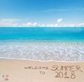 Welcome to summer 2018 written on a tropical beach Royalty Free Stock Photo