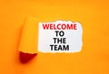 Welcome to the team symbol. Concept words Welcome to the team on beautiful white paper. Beautiful orange paper background. Royalty Free Stock Photo