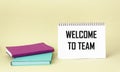 WELCOME TO THE TEAM text concept written on a notepad with diaries on a light background Royalty Free Stock Photo