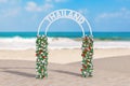 Welcome to Thailand Concept. Beautiful Decor Arc, Gate or Portal with Flowers and Thailand Sign on an Ocean Deserted Coast. 3d