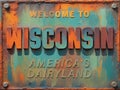 Welcome to Wisconsin rusted street sign