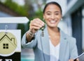 Welcome to your new home. a young female real estate agent holding keys to a new house thats been sold. Royalty Free Stock Photo