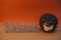 WELCOME Wood Inscription And Shaggy Hungry Monster With Huge Teeth Copyspace. Humorous Invitation. April Fools Day Joke