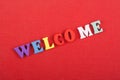 WELCOME word on red background composed from colorful abc alphabet block wooden letters, copy space for ad text. Learning english Royalty Free Stock Photo