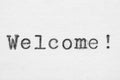 Welcome word on white paper printed with typewriter
