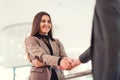 Welcoming business woman giving a handshake Royalty Free Stock Photo