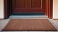 A welcoming entrance with a clean doormat in front of a closed elegant wooden door