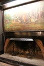 Inviting scene with fireplace and historic painting describing the area for guests, Red Coach Inn, Niagara Fall, New York, 2019