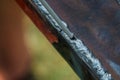 Weld on a metal profile and a welding electrode.