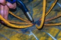 Welder cooks the product without gloves. Violation of safety regulations.