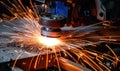 Welder Cutting Metal With Sparks