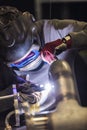 Welder industrial worker welding with argon machine Royalty Free Stock Photo