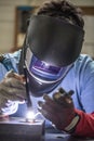 Welder industrial worker welding with argon machine Royalty Free Stock Photo