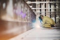 Welder makes welding inside an iron container Royalty Free Stock Photo