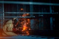 Welder makes welding inside an iron container Royalty Free Stock Photo