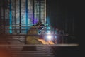 Welder makes welding inside an iron container Royalty Free Stock Photo