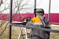 the welder makes welding of metal structures from a profile pipe with an electric welding machine. Construction of a Royalty Free Stock Photo