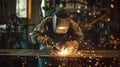 Welder man does metal welding in production with an industrial welding machine, sparks