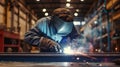 Welder man does metal welding in production with an industrial welding machine, sparks