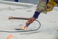 Welder man welding steel bars the supporting the precast concrete wall, worker with unprotected and unsafety