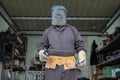 Welder in a mechanical workshop. An employee while working at th