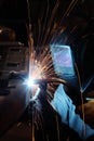 A welder in a metal fabrication facility.