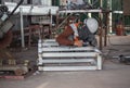 The welder in the operate,Employee welding U-steel using welder machine