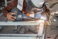 The welder in the operate,Employee welding U-steel using welder machine