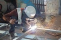 The welder in the operate,Employee welding U-steel using welder machine