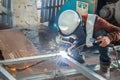 The welder in the operate,Employee welding U-steel using welder machine