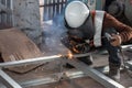 The welder in the operate,Employee welding U-steel using welder machine