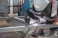 The welder in the operate,Employee welding U-steel using welder machine