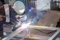 The welder in the operate,Employee welding U-steel using welder machine