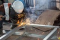 The welder in the operate,Employee welding U-steel using welder machine