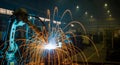 Welder performing arc welding in a large industrial facility wit Royalty Free Stock Photo