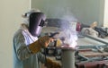 Welder performs welding work semi-automatic electric arc welding. MIG welding. Royalty Free Stock Photo