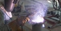 Welder performs welding work semi-automatic electric arc welding. MIG welding. Royalty Free Stock Photo