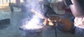 Welder performs welding work semi-automatic electric arc welding. MIG welding. Royalty Free Stock Photo