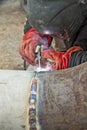 Welder performs welding works on pipelines