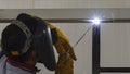 Welder in position over head action. Royalty Free Stock Photo