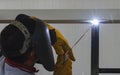 Welder in position over head action. Royalty Free Stock Photo