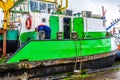 Welder repairing Bollards on a Large Cutter Suction Dredger vessel anchored for repairs in Urk in the Netherlands