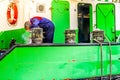 Welder repairing Bollards on a Large Cutter Suction Dredger vessel anchored for repairs in Urk in the Netherlands