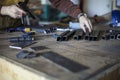 Welder selects tools and pre-cut steel parts. Royalty Free Stock Photo