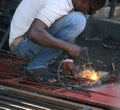 Welder on streets of Cap Haitien, Haiti