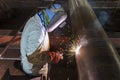 Welder is welding added joint a pipe carbon for steel structure work with process Flux Cored Arc Welding(FCAW) Royalty Free Stock Photo